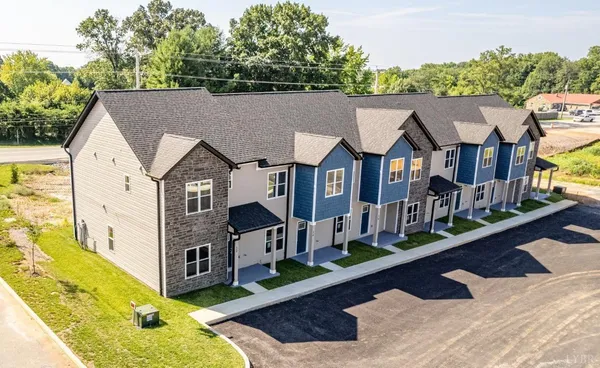 an aerial view of a house with swimming pool
