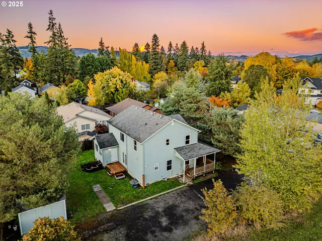 a aerial view of a house with a yard