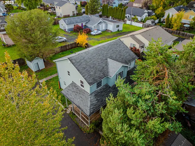an aerial view of a house with a garden