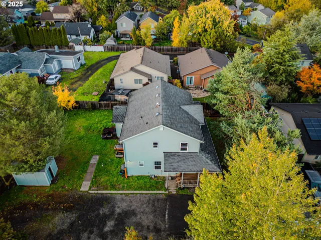 an aerial view of a house with a garden