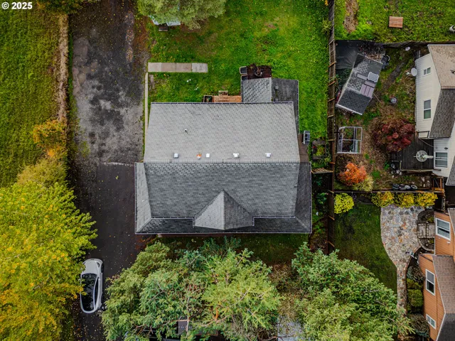 an aerial view of a house with a yard