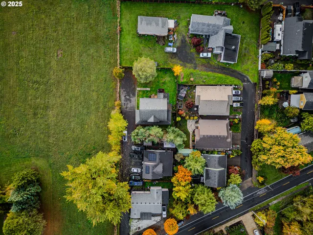 an aerial view of a house with a garden