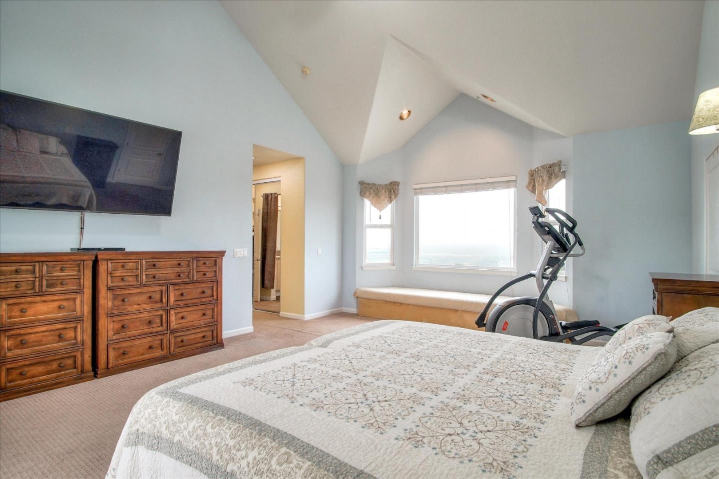 35635 Eagle Ridge Soledad, CA 93960 - Photo 18 of 50 a bedroom with a bed and a flat tv screen on dresser