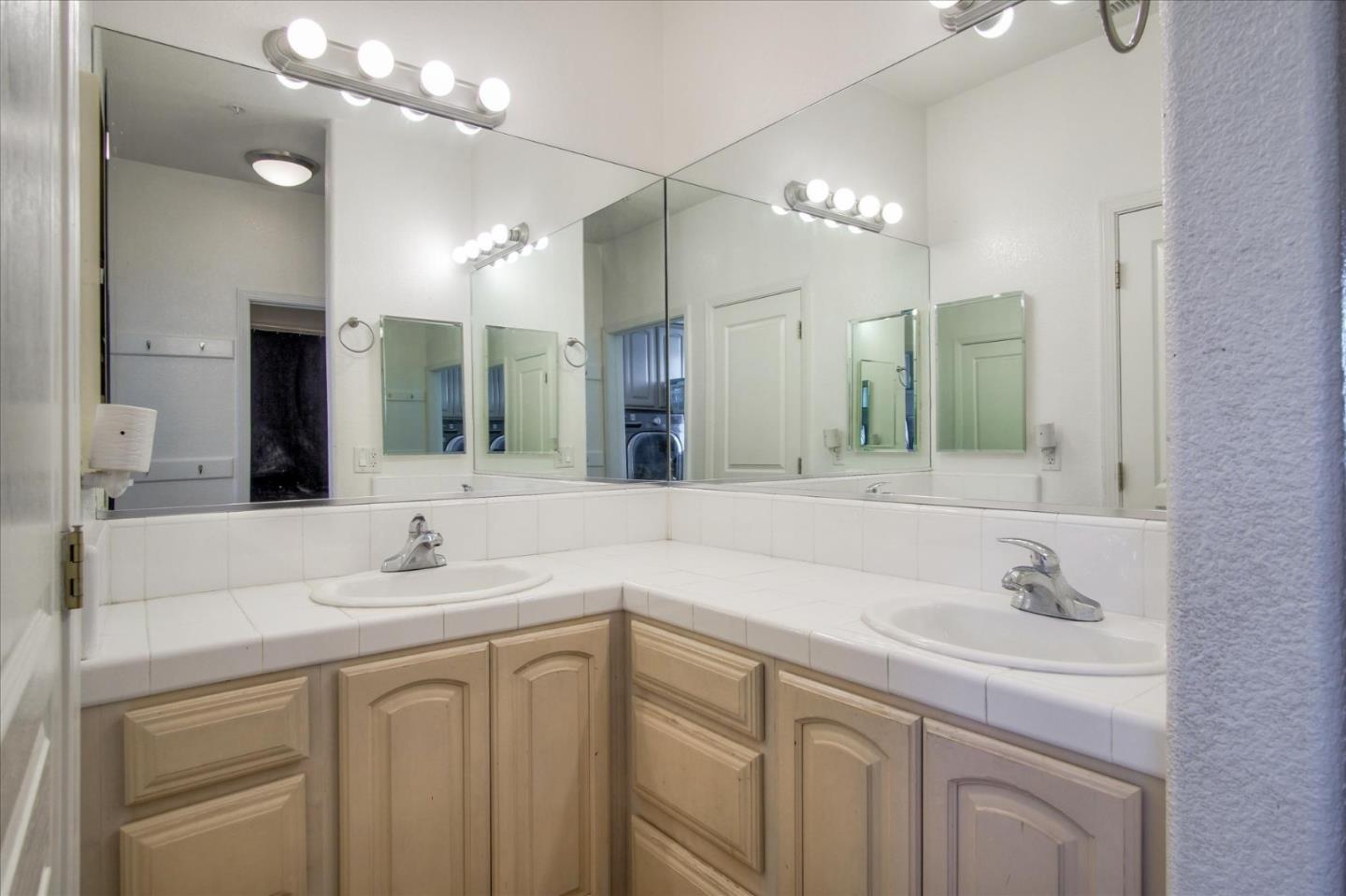 35635 Eagle Ridge Soledad, CA 93960 - Photo 30 of 50 a bathroom with a sink vanity and a mirror