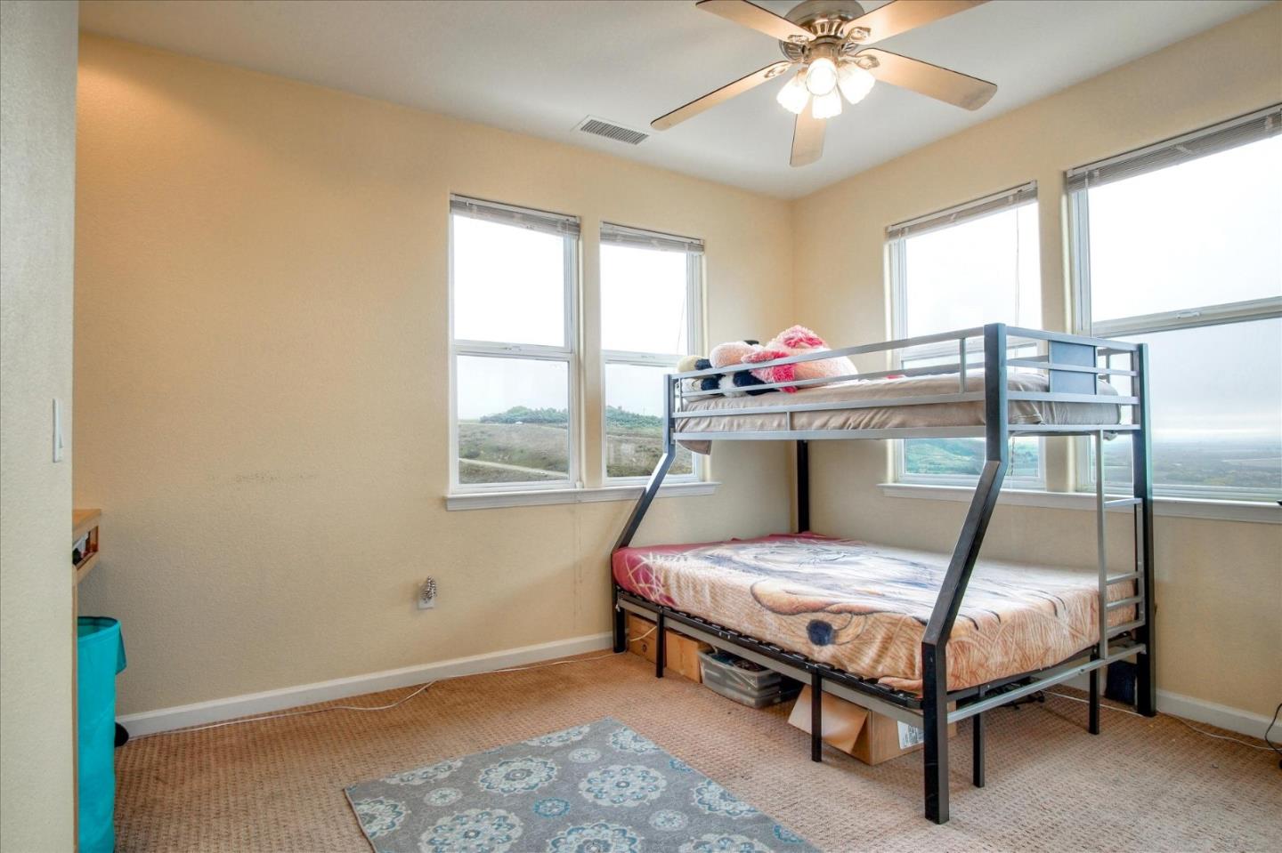 35635 Eagle Ridge Soledad, CA 93960 - Photo 34 of 50 a bedroom with a bed and a chandelier