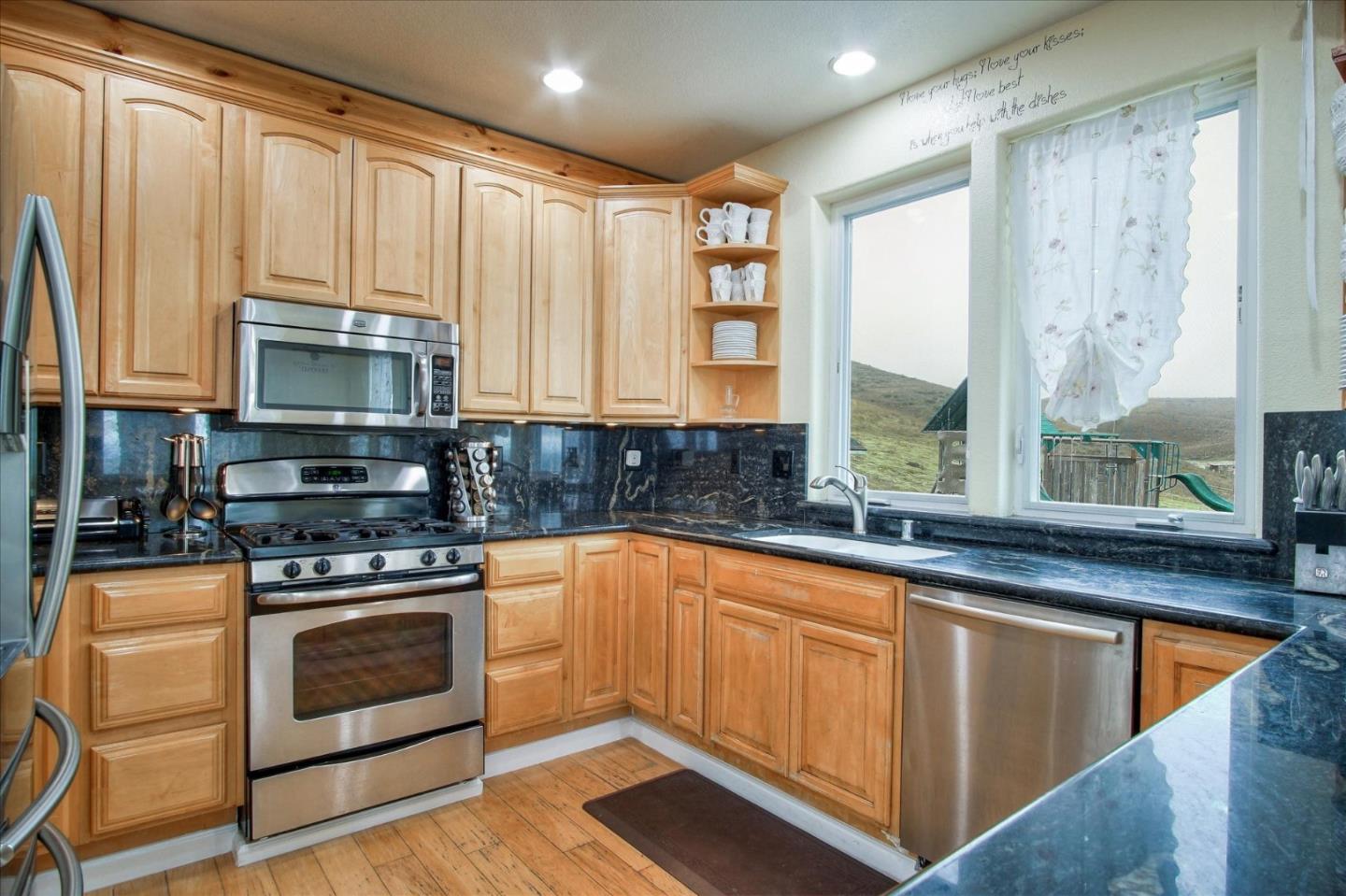 35635 Eagle Ridge Soledad, CA 93960 - Photo 42 of 50 a kitchen with stainless steel appliances a stove sink and microwave