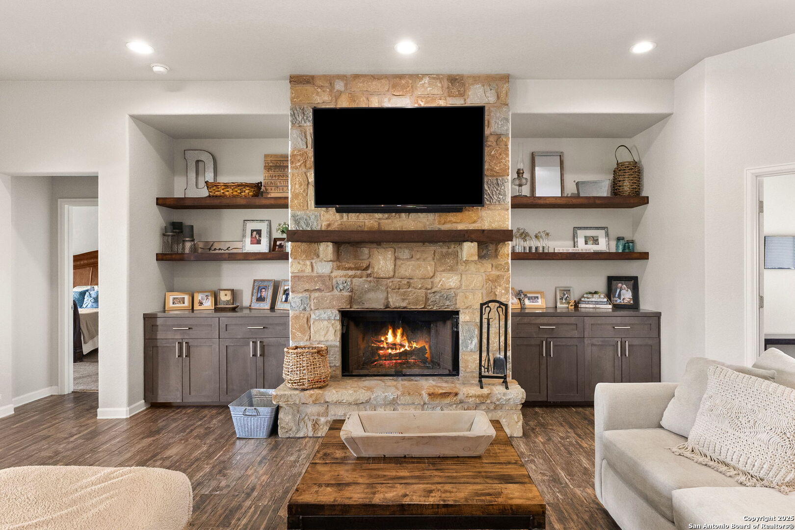 a living room with furniture and a fireplace