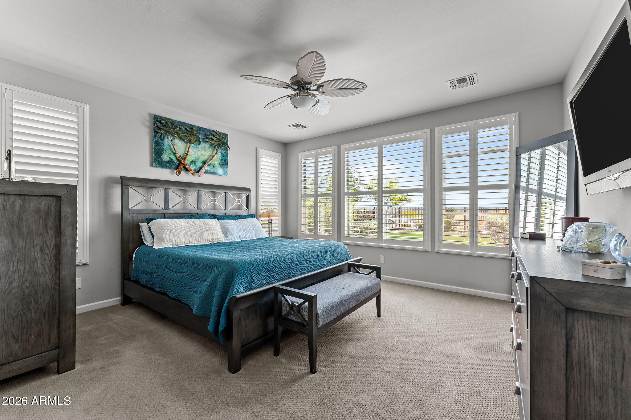 3855 Gold Ridge Road Wickenburg, AZ 85390 - Photo 20 of 38 a bedroom with a bed and a flat screen tv