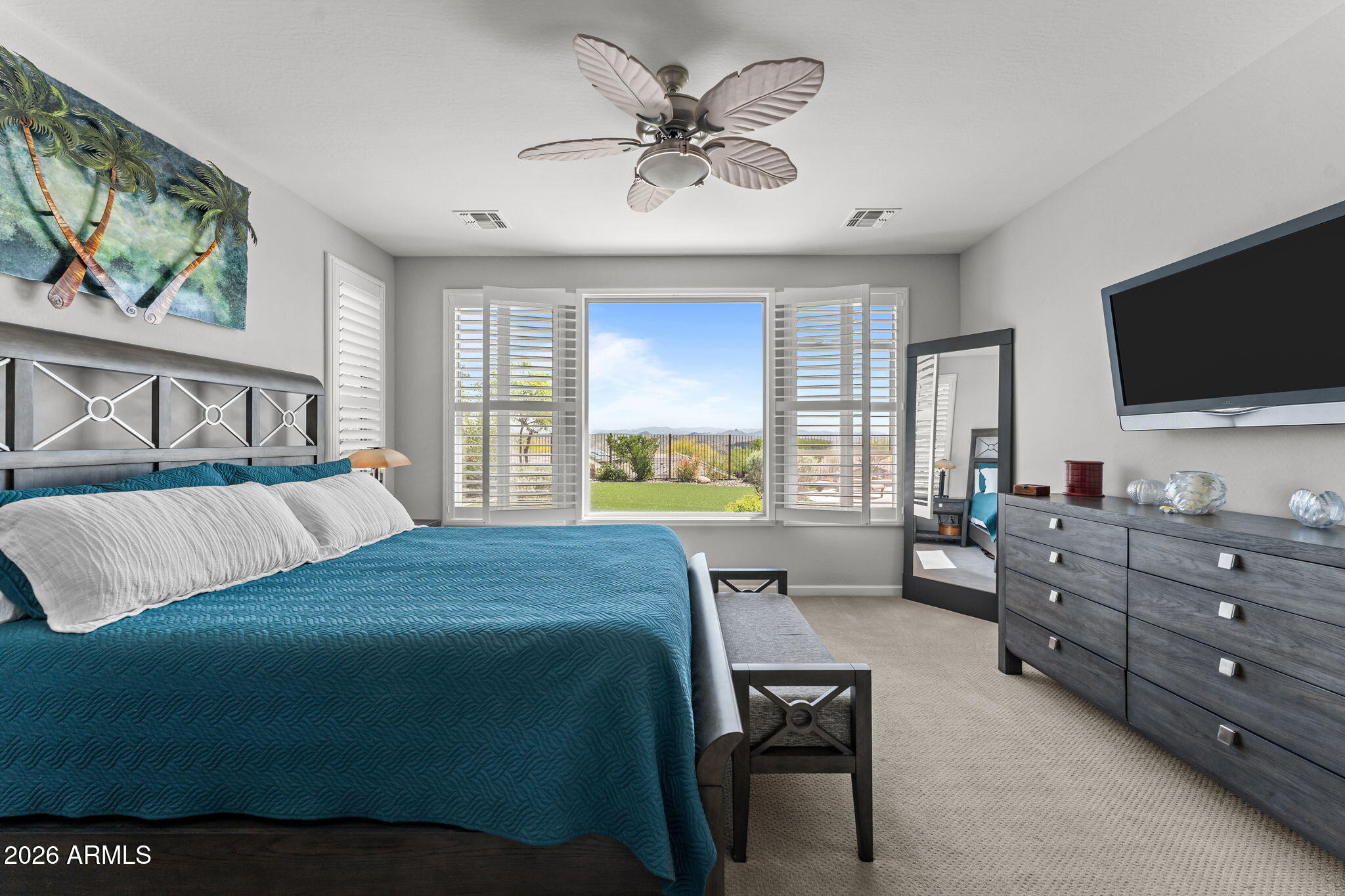 3855 Gold Ridge Road Wickenburg, AZ 85390 - Photo 21 of 38 a bedroom with a bed and a flat screen tv