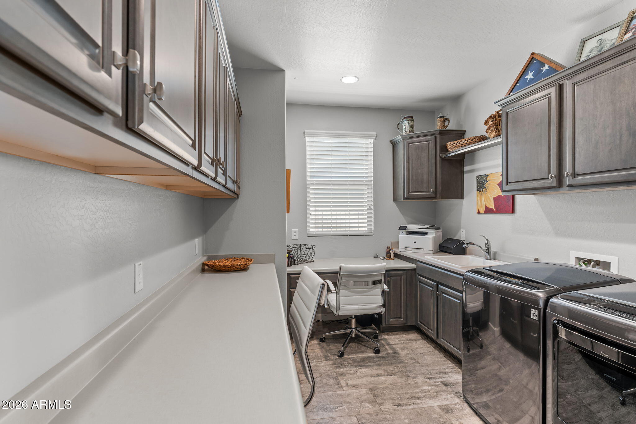 3855 Gold Ridge Road Wickenburg, AZ 85390 - Photo 25 of 38 a kitchen with a sink appliances and cabinets