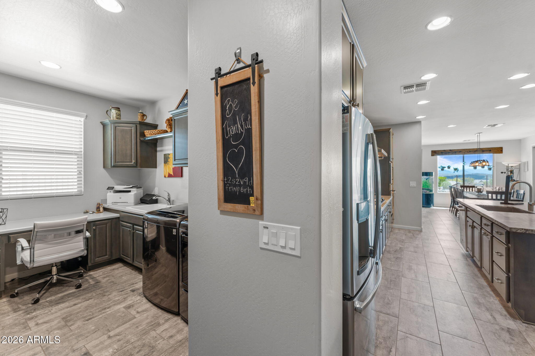 3855 Gold Ridge Road Wickenburg, AZ 85390 - Photo 26 of 38 a kitchen with stainless steel appliances kitchen island granite countertop a refrigerator and a sink