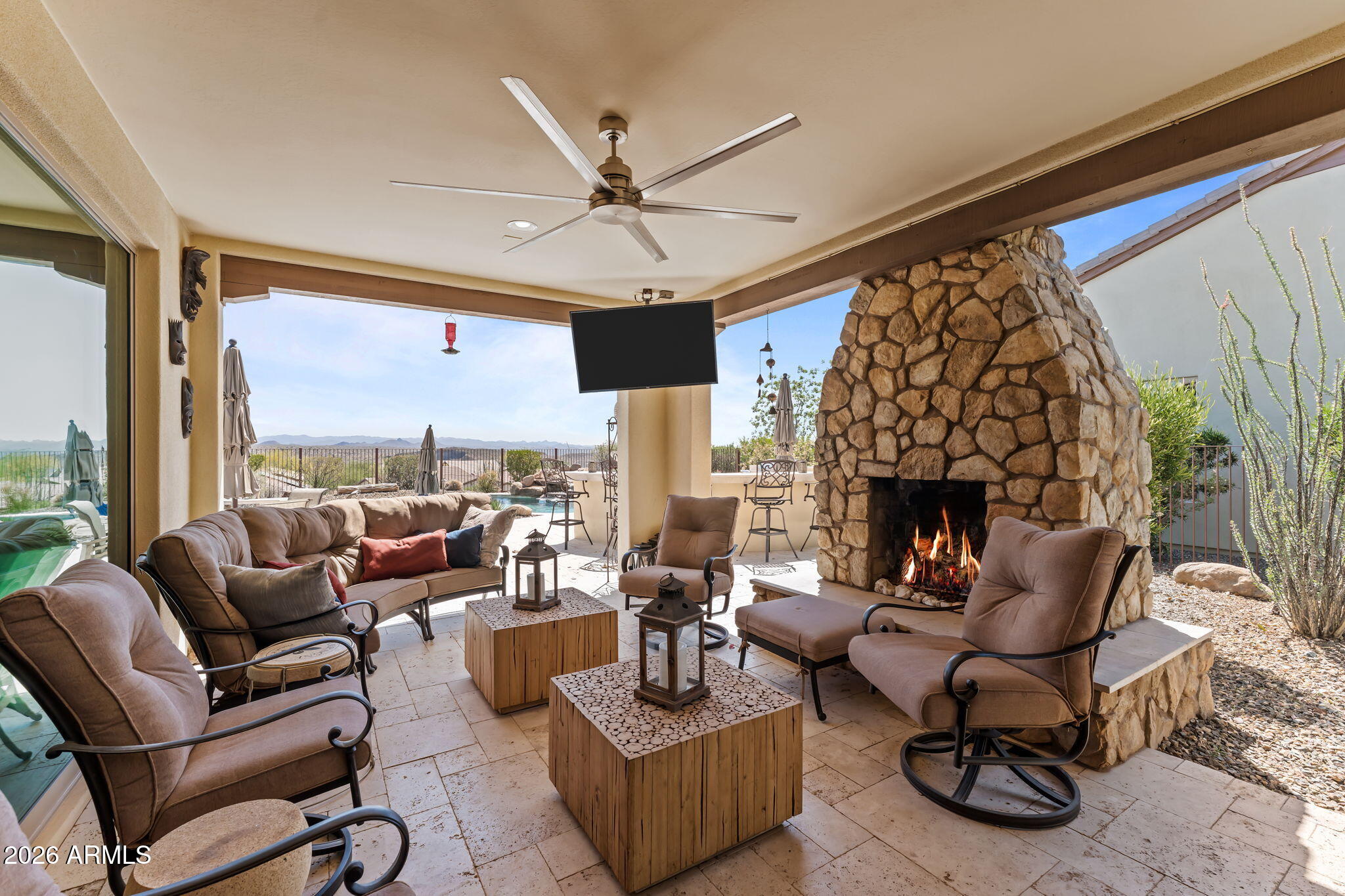 3855 Gold Ridge Road Wickenburg, AZ 85390 - Photo 3 of 38 a living room with furniture large window and a fireplace