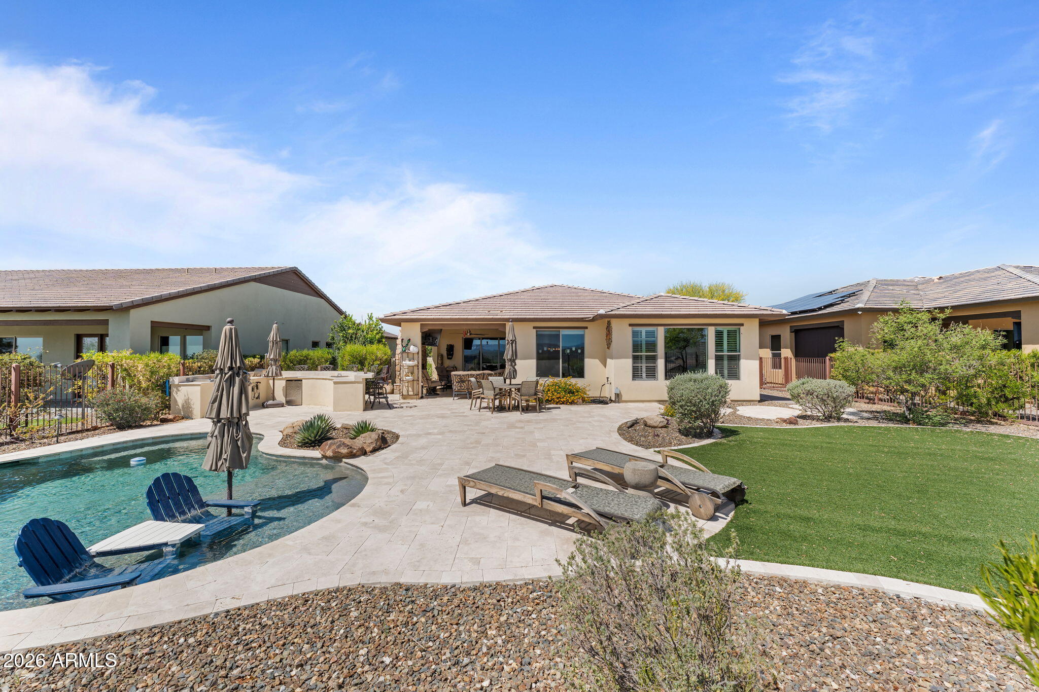 3855 Gold Ridge Road Wickenburg, AZ 85390 - Photo 31 of 38 a swimming pool view with a seating space and garden view