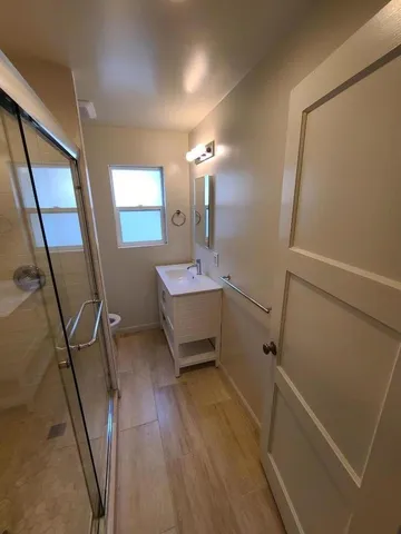 a bathroom with a sink a mirror and vanity