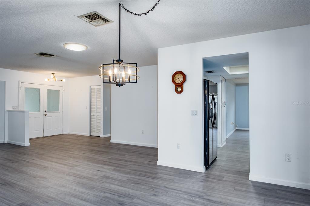 4814 Prince George Circle New Port Richey, FL 34655 - Photo 15 of 75 a view of a room with wooden floor
