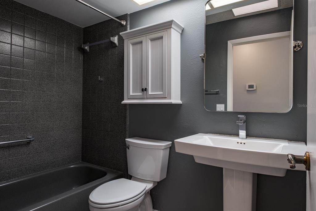 4814 Prince George Circle New Port Richey, FL 34655 - Photo 27 of 75 a bathroom with a sink a toilet and shower