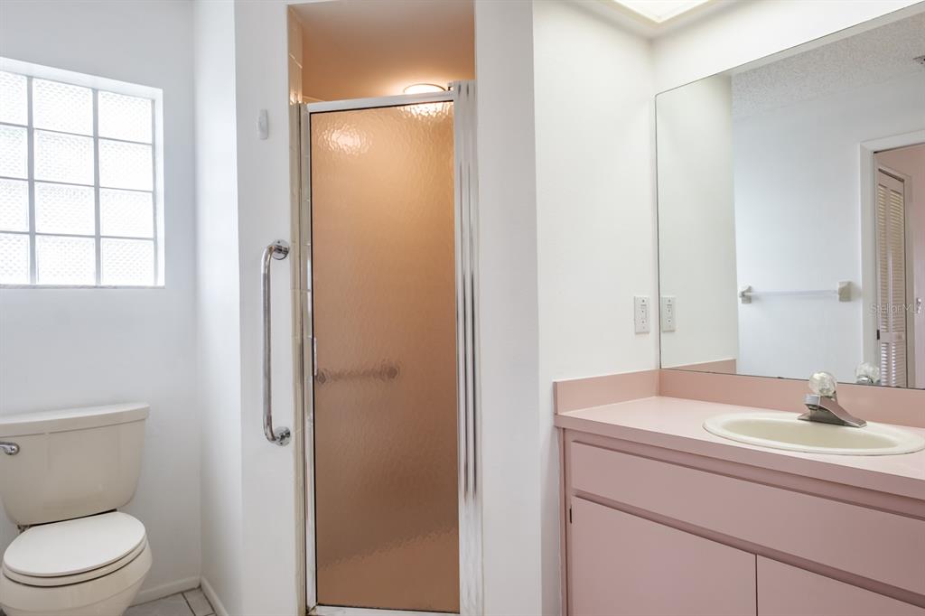 4814 Prince George Circle New Port Richey, FL 34655 - Photo 33 of 75 a bathroom with a sink toilet and shower