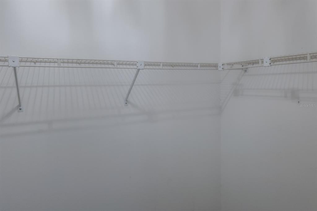 4814 Prince George Circle New Port Richey, FL 34655 - Photo 34 of 75 a view of a room with racks on the wall