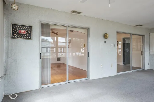 a living room with furniture a window and kitchen view
