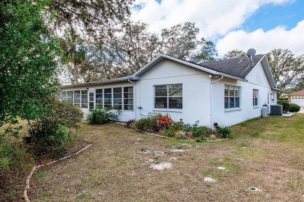 4814 Prince George Circle New Port Richey, FL 34655 - Photo 49 of 75 a view of a house with a yard