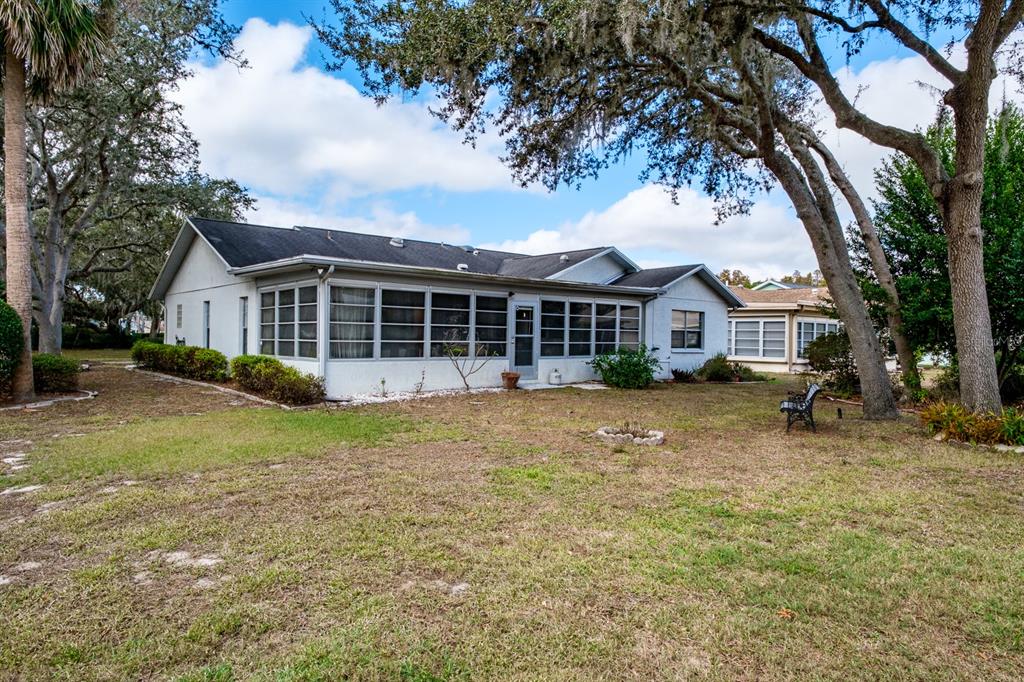 4814 Prince George Circle New Port Richey, FL 34655 - Photo 54 of 75 a view of house with outdoor space and sitting area