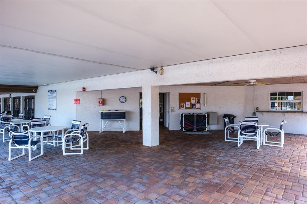 4814 Prince George Circle New Port Richey, FL 34655 - Photo 63 of 75 a living room with furniture a window and kitchen view