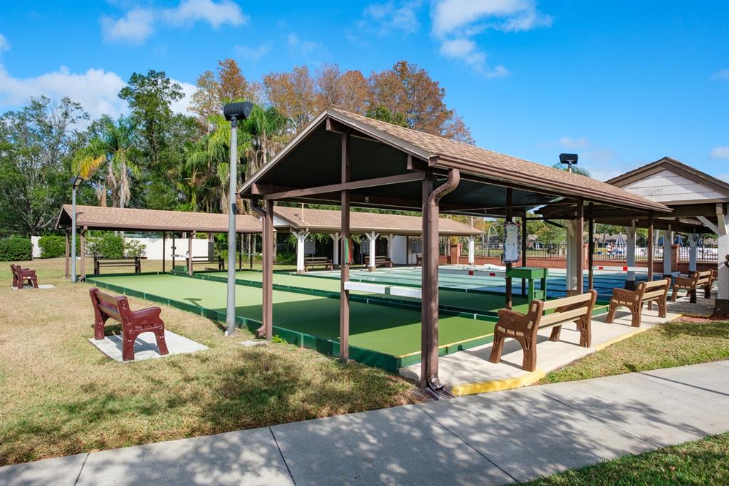 4814 Prince George Circle New Port Richey, FL 34655 - Photo 69 of 75 a view of a house with backyard porch and sitting area