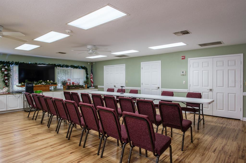 4814 Prince George Circle New Port Richey, FL 34655 - Photo 75 of 75 a view of a dining area with furniture and wooden floor