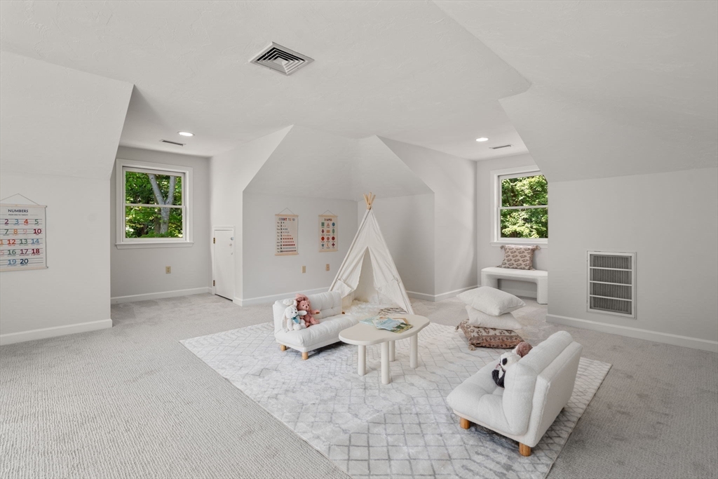 429 Warren Street Needham, MA 02492 - Photo 18 of 40 a living room with furniture and a wooden floor