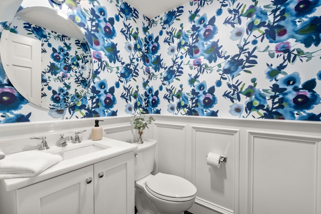 429 Warren Street Needham, MA 02492 - Photo 19 of 40 a bathroom with a sink toilet and vanity