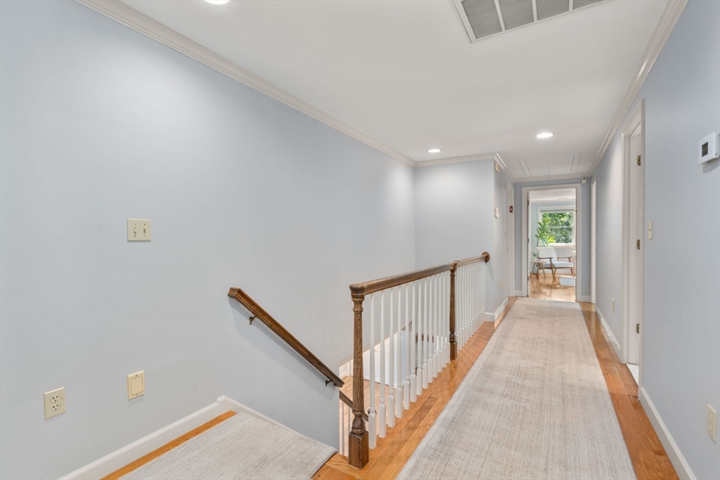 429 Warren Street Needham, MA 02492 - Photo 20 of 40 a view of a hallway with wooden floor