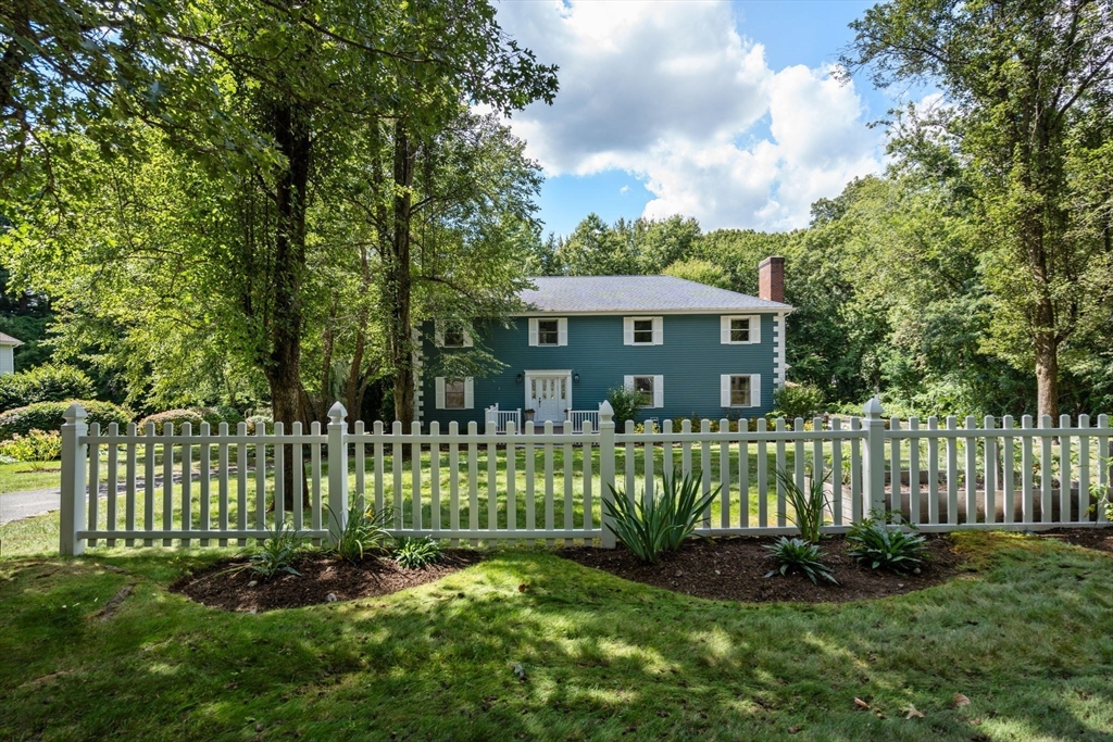 429 Warren Street Needham, MA 02492 - Photo 2 of 40 a front view of a house with a garden
