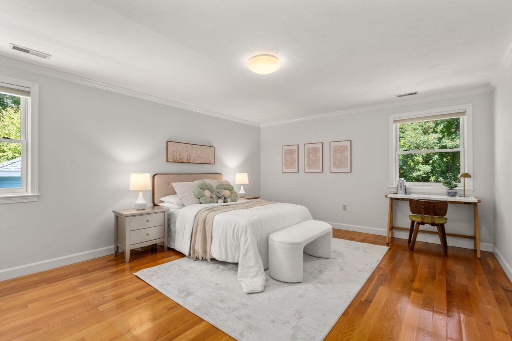 429 Warren Street Needham, MA 02492 - Photo 21 of 40 a bedroom with a bed and a table