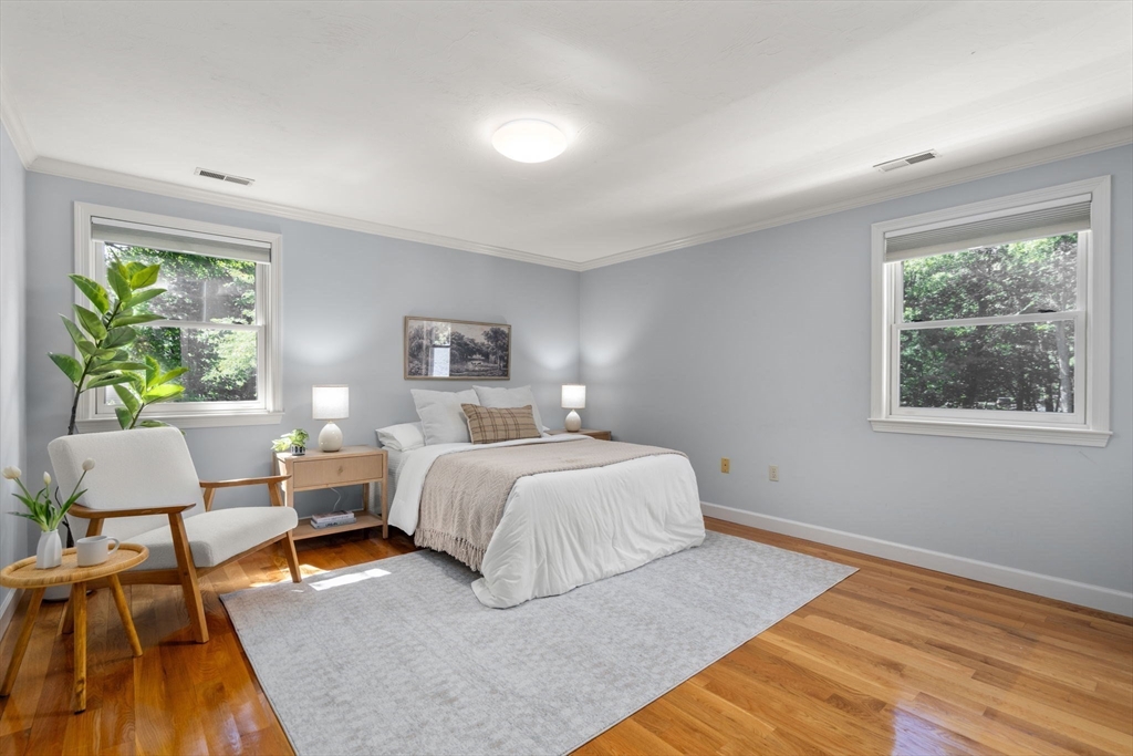 429 Warren Street Needham, MA 02492 - Photo 23 of 40 a bedroom with a bed and a couch