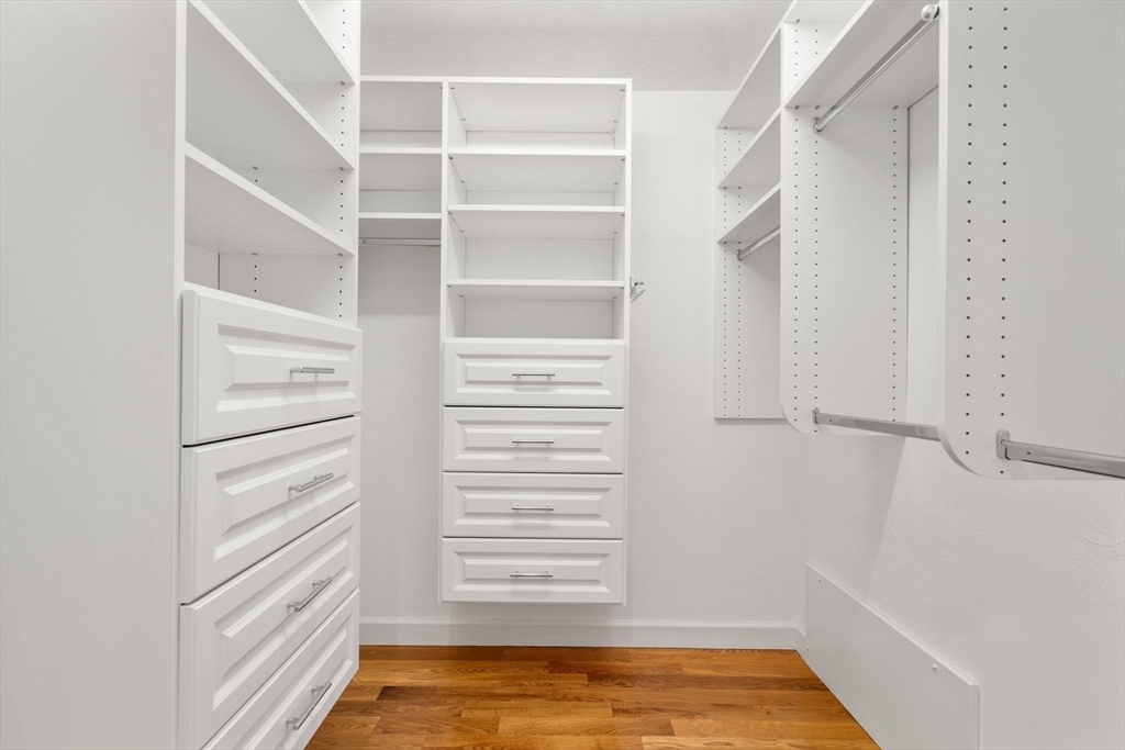 429 Warren Street Needham, MA 02492 - Photo 28 of 40 a view of walk in closet with empty racks