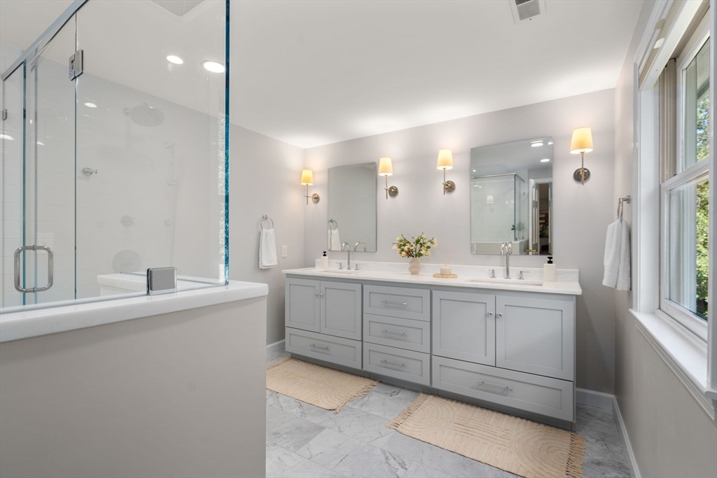 429 Warren Street Needham, MA 02492 - Photo 29 of 40 a bathroom with a double vanity sink mirror and double