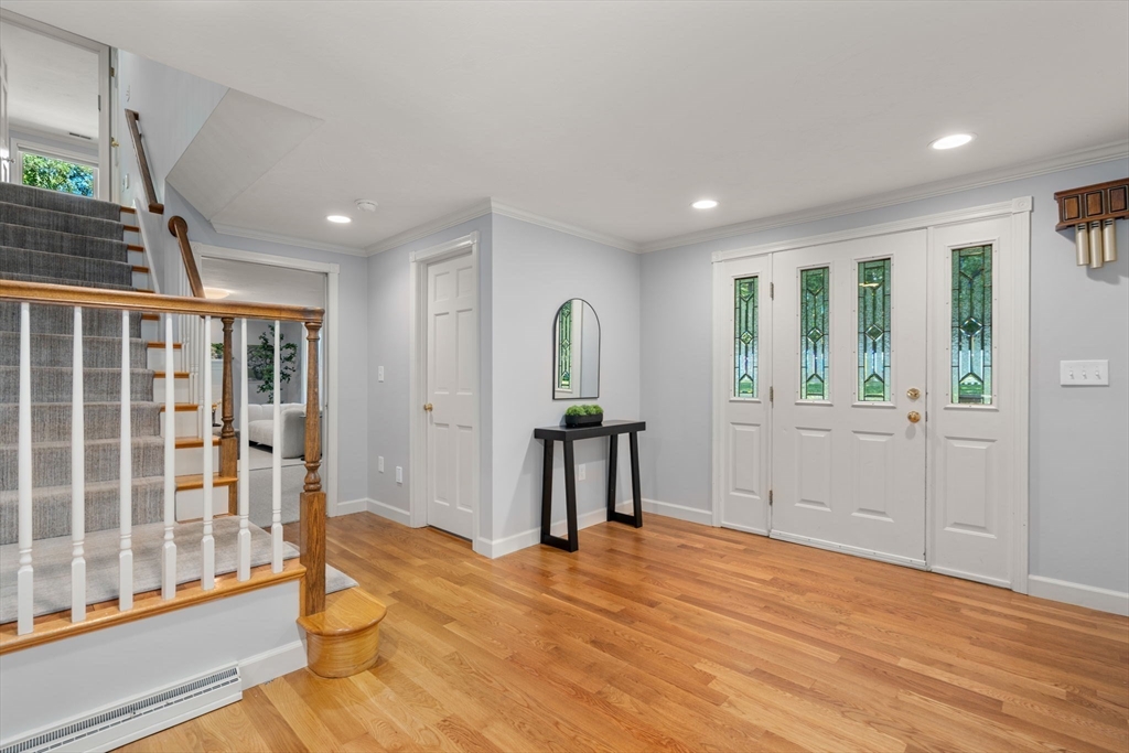 429 Warren Street Needham, MA 02492 - Photo 3 of 40 a view of empty room with wooden floor and fan