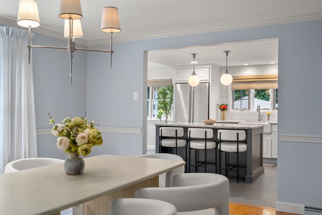 429 Warren Street Needham, MA 02492 - Photo 9 of 40 a dining room with furniture and wooden floor