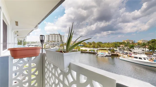 a view of residential houses with outdoor space and swimming pool