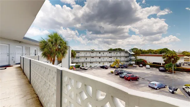 a view of a car park in front of a building