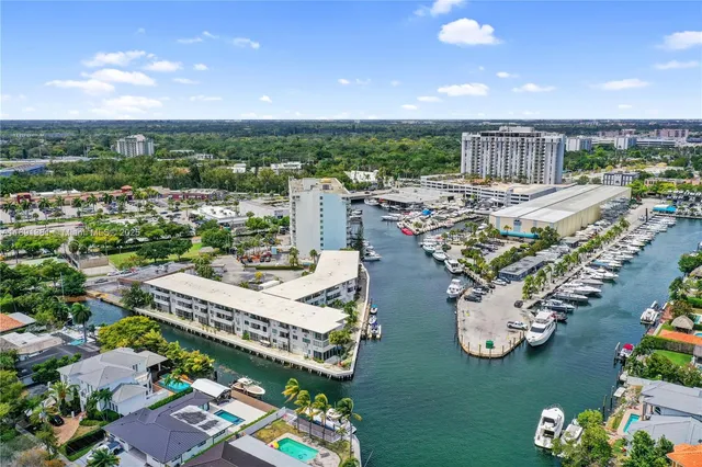 an aerial view of a house with swimming pool patio and outdoor seating