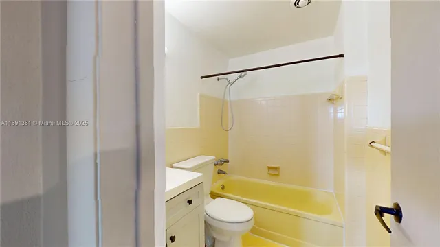 a bathroom with a sink a toilet and a bathtub