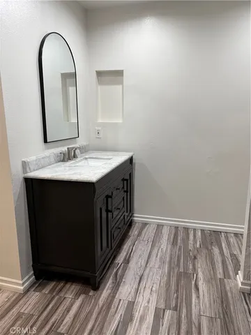 a white toilet sitting next to a small sink