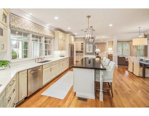 3 Gardner Terrace Hingham, MA 02043 - Photo 12 of 29 a large white kitchen with lots of counter space dining table and chairs