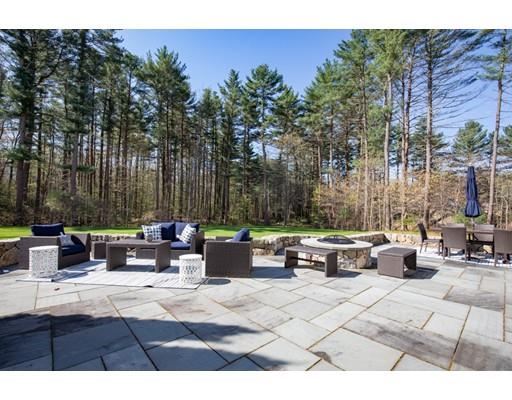 3 Gardner Terrace Hingham, MA 02043 - Photo 4 of 29 a view of a patio with couches and a table and chairs with wooden fence
