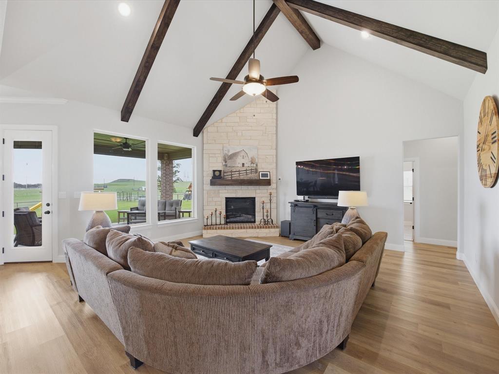 150 Quail Ridge Decatur, TX 76234 - Photo 11 of 32 a living room with furniture fireplace and a flat screen tv