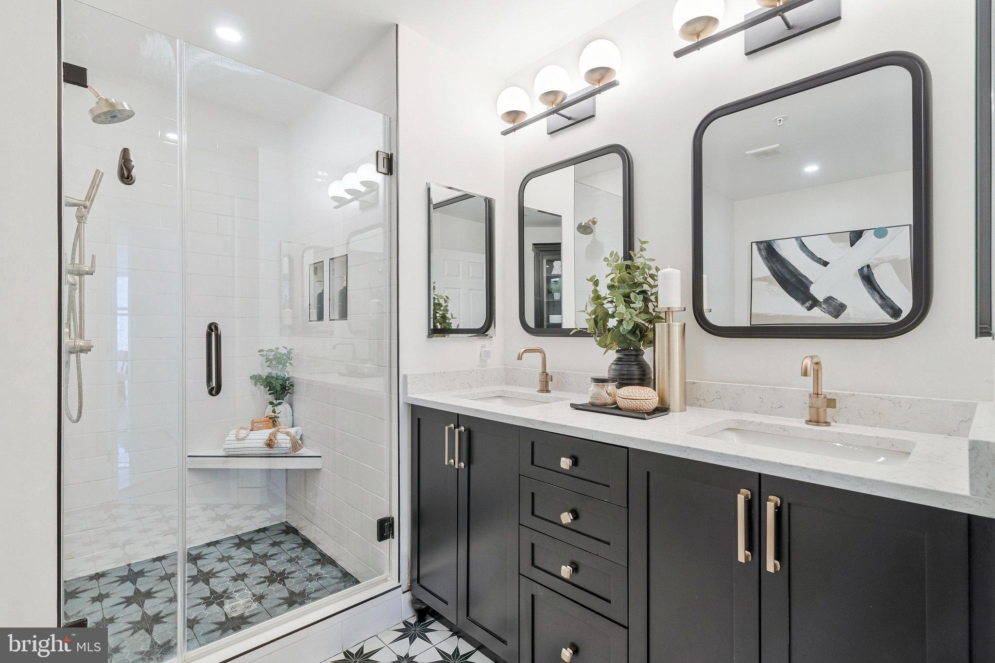 11776 Stratford House Place, Unit 807 Reston, VA 20190 - Photo 17 of 25 a bathroom with a double vanity sink and a mirror