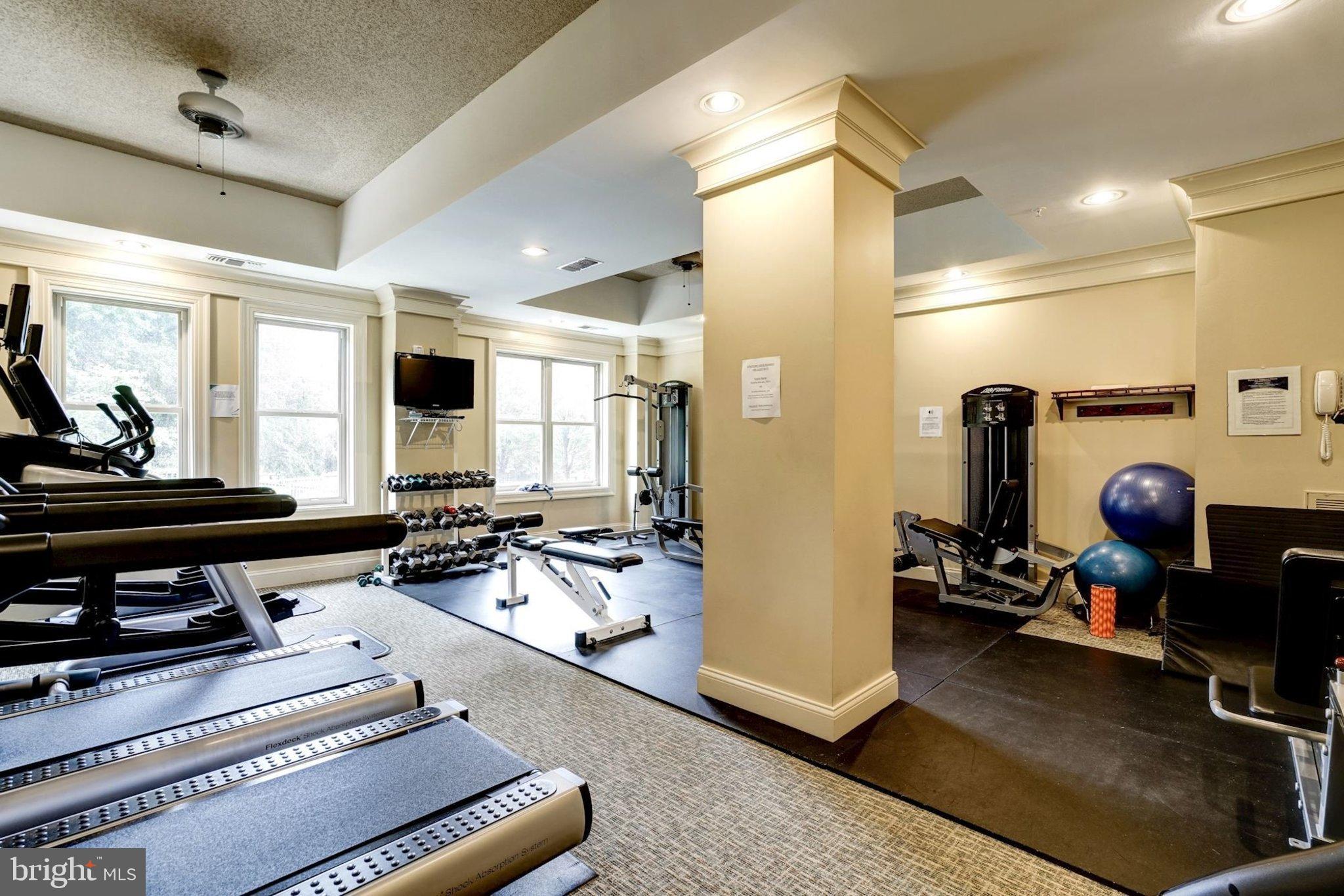 11776 Stratford House Place, Unit 807 Reston, VA 20190 - Photo 24 of 25 a room with lots of furniture and gym equipment