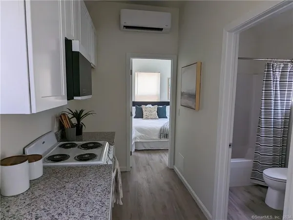 a kitchen with a stove a sink and a refrigerator