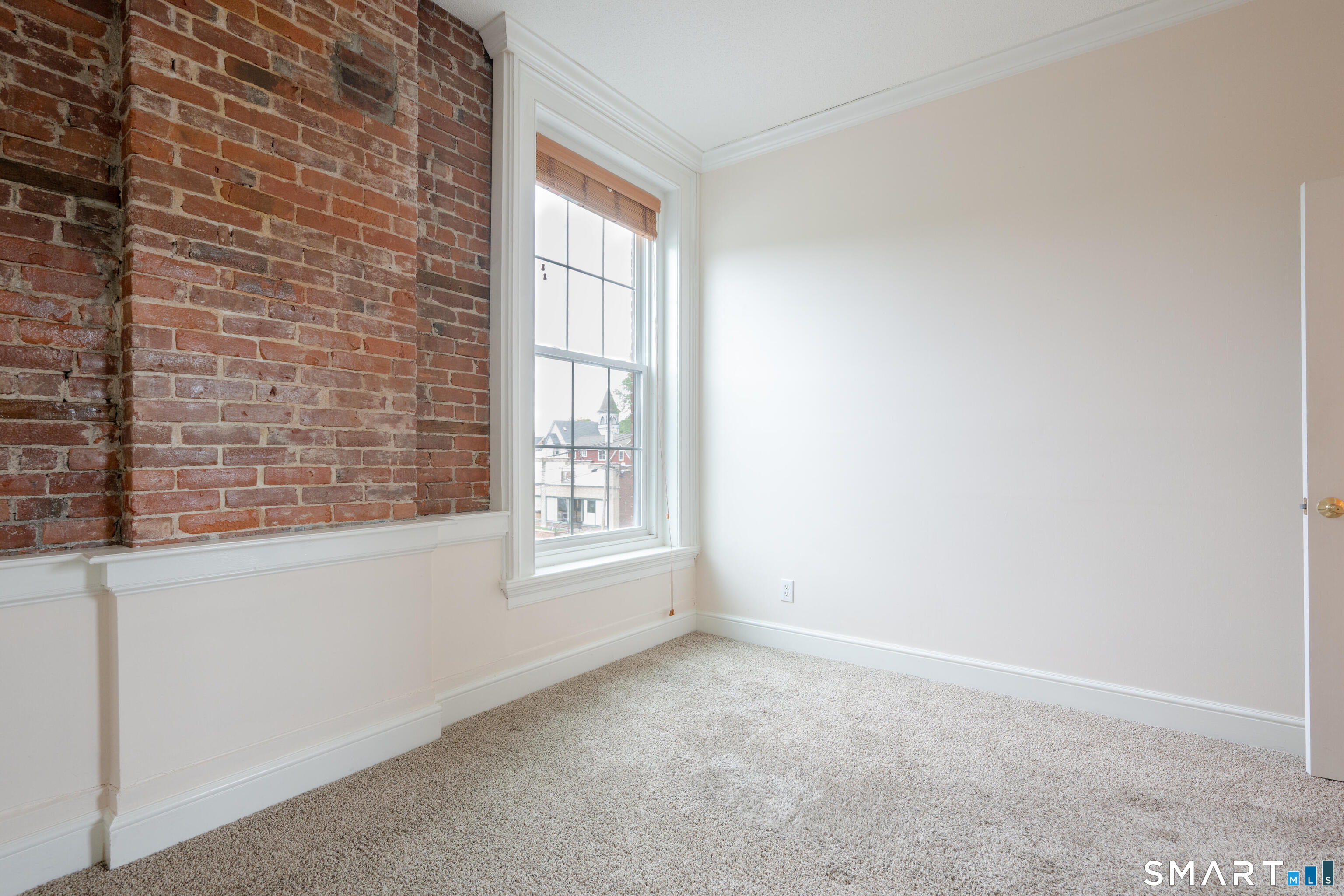 130 Main Street, Unit 2D Canton, CT 06019 - Photo 14 of 25 a view of an empty room with a window